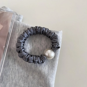 Elegant grey satin scrunchie with large pearl detail for stylish women hair styling