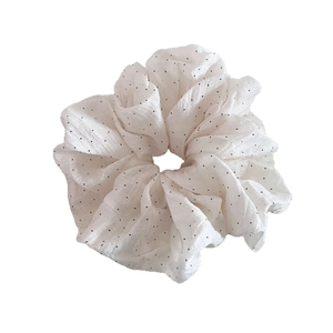 French style white bubble cotton scrunchie with black polka dots and pleated texture