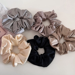 Set of 5 glossy satin hair scrunchies in neutral colors including black and beige