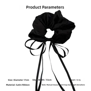 Macro view showing dimensions and weight of this black satin ribbon scrunchie hair accessory