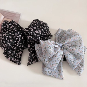 Set of two vintage chiffon floral bow hair claws for elegant half-up hairstyles
