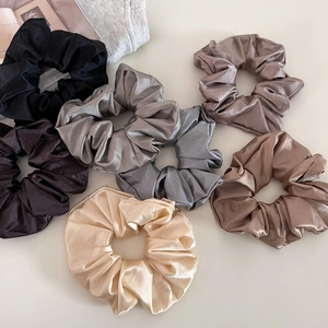 Set of 7 elegant satin silk scrunchies in neutral colors for versatile hair styling