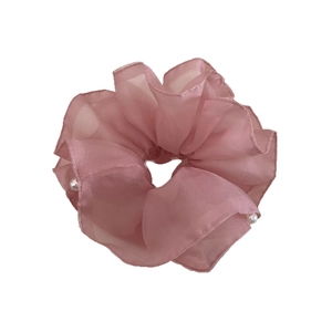 Elegant double-layered pink organza scrunchie with white pearl beads on white background