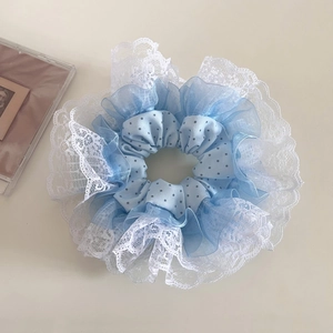 Oversized blue polka dot scrunchie with layered mesh and white lace edge details