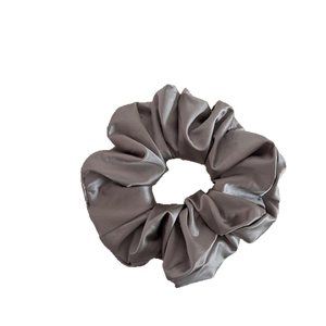 Elegant grey satin scrunchie with a glossy silk finish for minimalist women hair styling