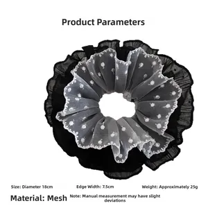 Detailed view of oversized polka dot lace scrunchie with 18cm diameter measurements