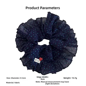 Polka dot fabric scrunchie detail showing 21.5cm diameter and hand made tag