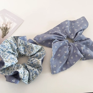 Blue floral and polka dot scrunchie set with bow detail for women's hairstyles