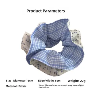 Detailed dimensions of blue floral and plaid patchwork fabric scrunchie, 16cm diameter