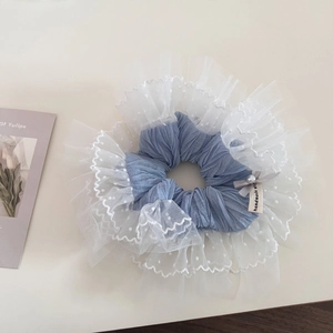 Blue ruffled mesh hair scrunchie with white dots and elegant pearl bow decoration
