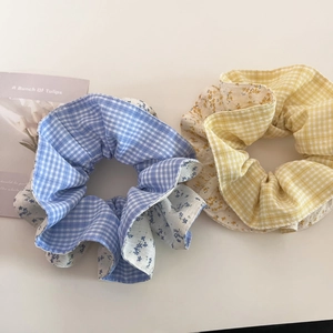 Floral plaid fabric scrunchies in blue and yellow colors for women ponytail hairstyles