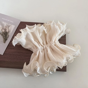 Detailed view of off-white pleated ruffles hair scrunchie with soft translucent texture