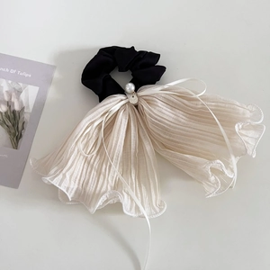 Elegant beige mesh scrunchie with layered ruffle bow and pearl charm hair accessory