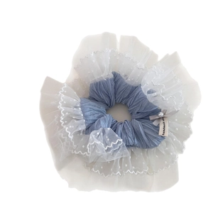 Oversized grey-blue pleated scrunchie with white polka dot lace edges and pearl bow