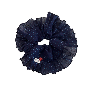 Navy blue polka dot chiffon scrunchie with handmade label and red heart button detail