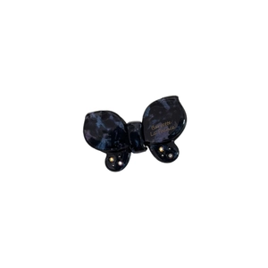 Acetate butterfly hair clip with marble texture and rhinestones on white background