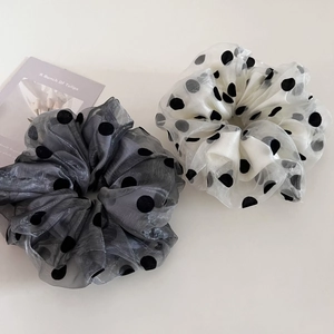 Double-layered mesh polka dot scrunchies in grey and white for stylish hair styling