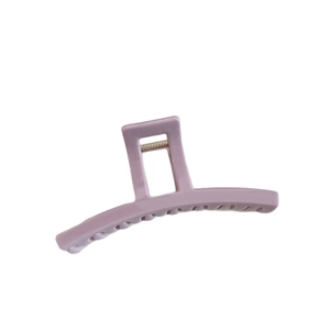 Minimalist lavender matte hair claw clip with elegant curved design on white background