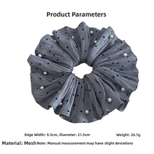Detail of oversized grey polka dot scrunchie with pearls, 21.5cm diameter gauze fabric