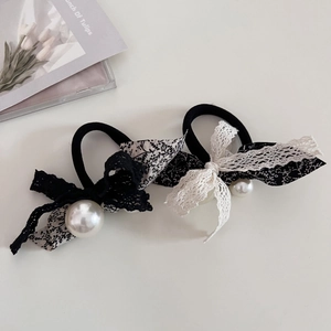Detail of floral lace bow hair ties with pearl accents and high elastic bands