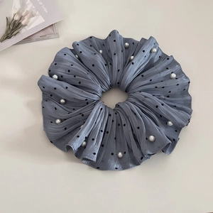 Chic blue polka dot scrunchie with pearls for elegant ponytails and minimalist styling