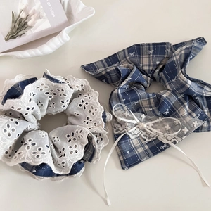 Detail showing vintage blue plaid scrunchies with white lace edges and pearl accents