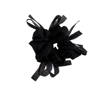 Elegant black tulle hair scrunchie with large ribbon bow for graceful ponytail styling