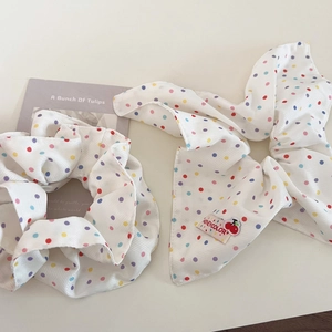 Polka dot fabric scrunchie set in creamy white with colorful spots and ribbon detail
