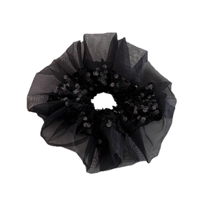 Elegant black organza scrunchie with sparkling sequins for stylish hair styling