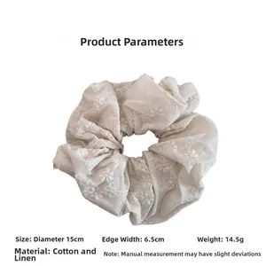 Detail of 15cm linen scrunchie with delicate floral embroidery and 6.5cm width