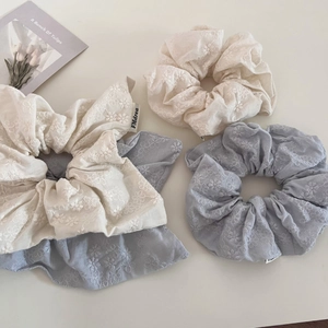 Detailed embroidery flowers on cotton-linen scrunchies in white and blue shades