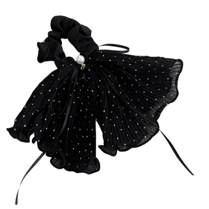 Elegante elastico in tulle nero a pois con grande fiocco e dettaglio di perle