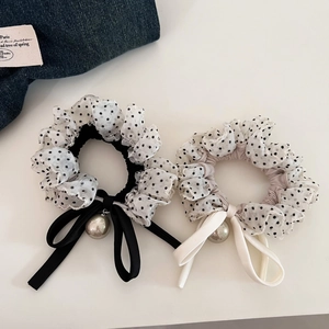 Detail of polka dot organza hair scrunchies with ribbon bows and silver bead charms