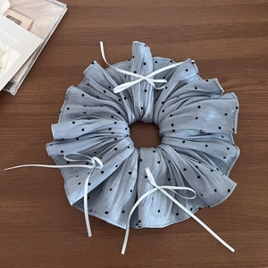 Elegant light blue polka dot scrunchie with white bows for stylish ponytail styling