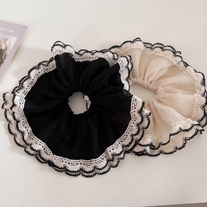 Detailed close-up of double-layer mesh lace hair scrunchies in black and beige colors