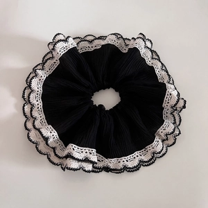 Elegant black double-layered mesh scrunchie with white lace trim for hair styling