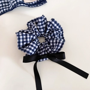 Navy blue gingham check scrunchie with heart print and long black satin bow ribbon