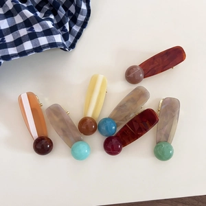 Vintage acetate hair clips set with colorful ink dot accents in diverse retro colors