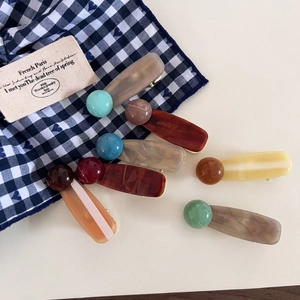 Set of 6 colorful acetate hair clips with marbled textures in various trendy shades