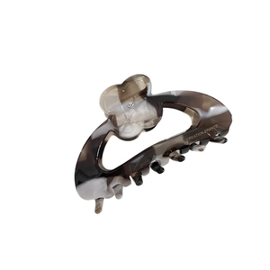 Elegant French acetate flower hair claw clip with marble texture and rhinestone center