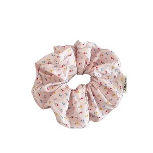 Pink floral print scrunchie with lace edge for ponytail and hair styling accessory