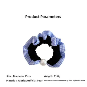 Detail of blue plaid fabric scrunchie with large white faux pearl, 11cm diameter size