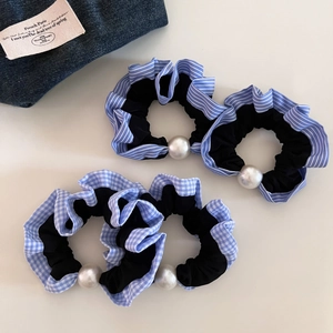 Set of four blue striped and plaid scrunchies with white pearl accents and ruffles