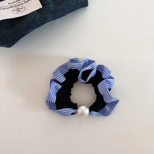 Blue and white striped scrunchie with large white pearl detail on a black elastic band