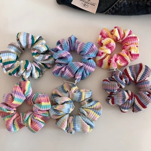 Set of six colorful striped scrunchies in textured rib fabric for ponytail hairstyles