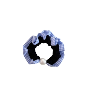 Vintage blue gingham checkered hair scrunchie with large pearl accent on white backdrop