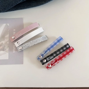 Set of 6 stylish acetate hair clips with heart accents in various colors and patterns