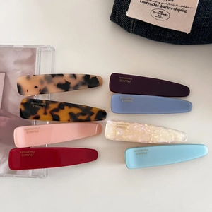 Close-up of assorted acetate drop hair clips with France Handmade gold lettering