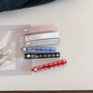 6-piece set of heart-accented acetate hair clips in assorted patterns and pastel colors