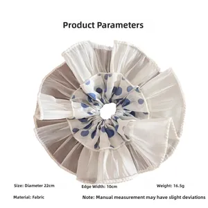 Detailed size chart for the blue polka dot scrunchie showing 22cm diameter and fabric material